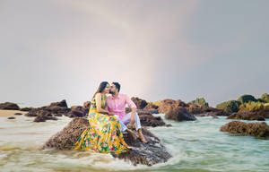 Romantic Couple On Beach Boulder Wallpaper