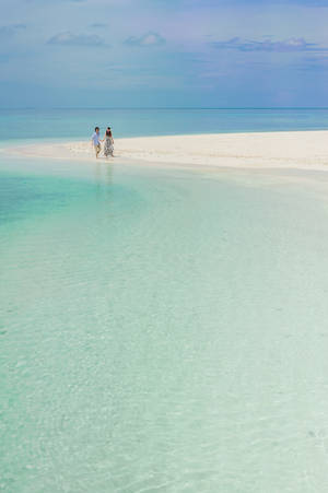 Romantic Couple On White Beach Sand Wallpaper