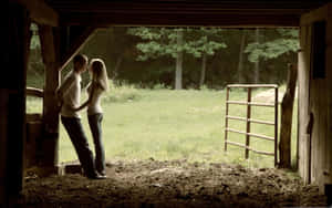 Romantic Couplein Barn Doorway Wallpaper