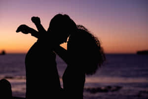 Romantic Silhouette Couple Sunset Wallpaper