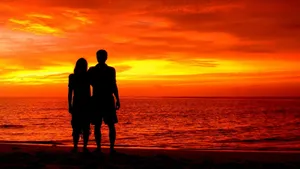 Romantic Sunset Beach Stroll Wallpaper
