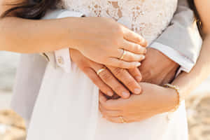 Romantic Wedding Photo Of A Couple's Tangible Hug Wallpaper