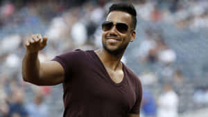 Romeo Santos Smilingwith Fans Wallpaper