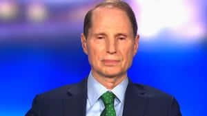 Ron Wyden Blue Background Front View Wallpaper