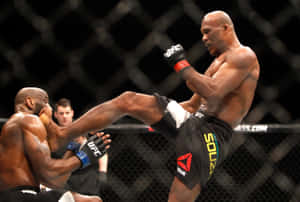 Ronaldo Souza Kicking Derek Brunson Wallpaper