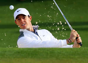 Rory Mcilroy Pro Golfer Perfectly Captures A Tee Shot Wallpaper