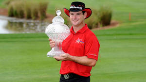 Rory Sabbatini Proudly Holding His Winning Trophy Wallpaper