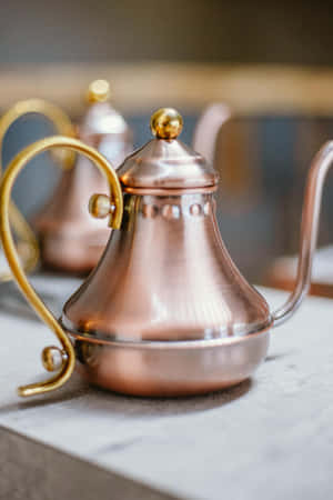 Rose Gold Coffee Pot Elegance Wallpaper