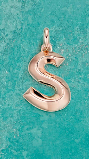 Rose Gold S Letter Pendanton Aqua Background Wallpaper