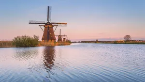 Rotterdam Windmillsat Sunset Wallpaper