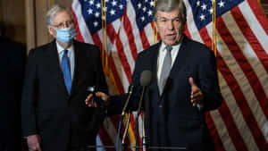 Roy Blunt Addressing The Audience Wallpaper