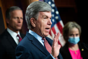 Roy Blunt With One Hand Raised Wallpaper