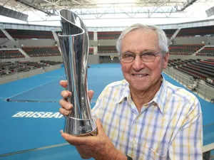Roy Emerson Holding Trophyat Brisbane Tennis Court Wallpaper