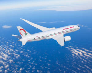 Royal Air Maroc Plane Above The Ocean Blue Wallpaper