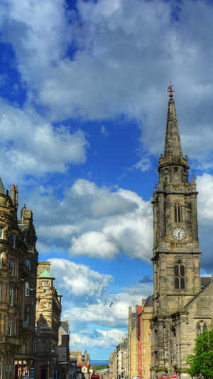 Royal Mile Edinburgh Spireand Clouds Wallpaper