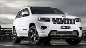 Rugged Beauty: A Jeep Grand Cherokee In Its Natural Habitat Wallpaper