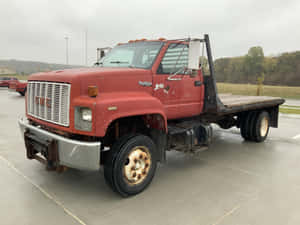 Rugged Gmc Topkick On A Scenic Country Road Wallpaper