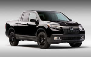 Rugged Honda Ridgeline Cruising On An Open Road Wallpaper