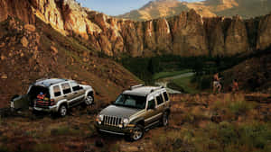 Rugged Jeep Liberty Conquering The Wilderness Wallpaper