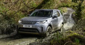 Rugged Land Rover Discovery On Mountain Road Wallpaper