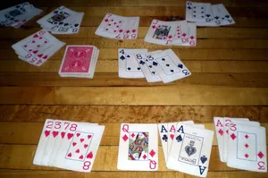 Rummy Playing Cards On The Floor Wallpaper
