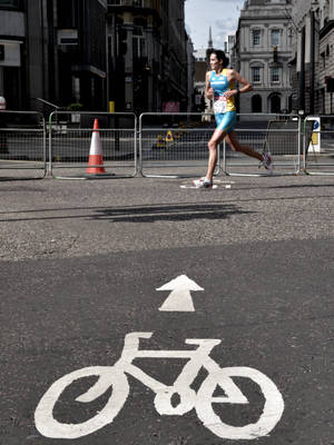 Runner On Grey Concrete Road Wallpaper