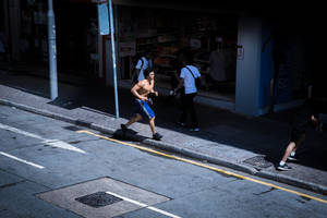 Runner On Side Of Road Wallpaper