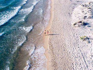 Runners On White Sand Beach Wallpaper