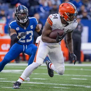 Running_ Back_ Evades_ Defender_ Football_ Game Wallpaper