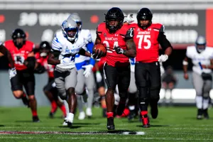 Running Backin Action During Football Game Wallpaper