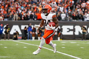 Running Backin Actionat Football Game Wallpaper