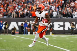 Running Backin Actionat Football Game Wallpaper