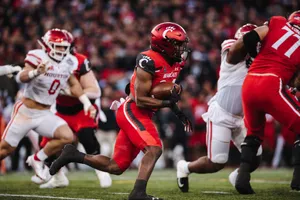 Running Backin Actionat Football Game Wallpaper