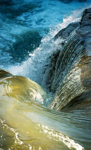 Rushing Water Over Rocks.jpg Wallpaper