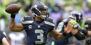 Russel Wilson Seahawks Throwing Football Wallpaper