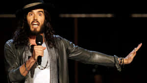 Russell Brand Comedian On Stage Wallpaper