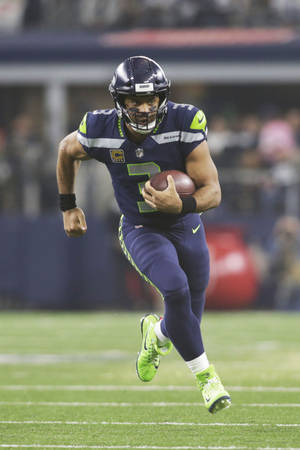 Russell Wilson Full Body Running Wallpaper