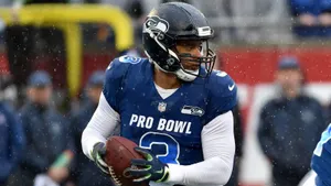 Russell Wilson Smiling With Ball Wallpaper