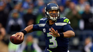 Russell Wilson Twisting Hand Wallpaper