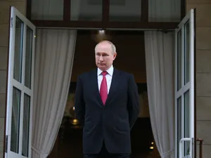 Russian President, Vladimir Putin Standing In Front Of Open Doors Wallpaper