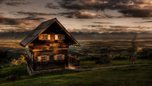 Rustic Cabin At Sunset Wallpaper