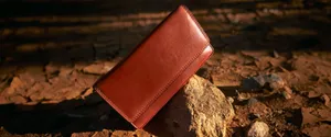 Rustic Leather Wallet Outdoor Setting Wallpaper
