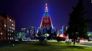 Ryugyong Hotel Illuminated At Night In Pyongyang, North Korea Wallpaper