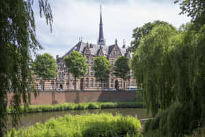 S Hertogenbosch Historic Building Beside Waterway Wallpaper