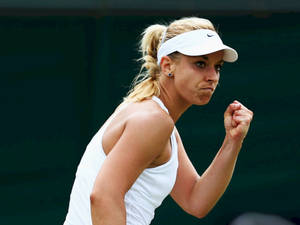 Sabine Lisicki Celebrating Victory With A Fist Pump Wallpaper