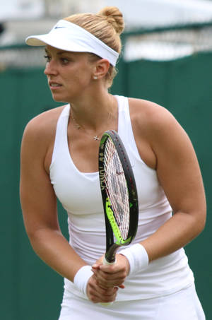 Sabine Lisicki Glowing In A White Tennis Outfit Wallpaper