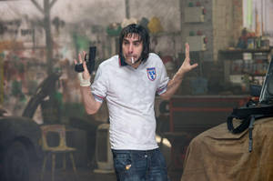 Sacha Baron Cohen As Norman Butcher Wallpaper