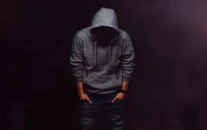 Sad Guy In A Gray Hoodie Wallpaper