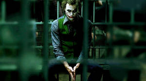 Sad Joker Behind Bars Wallpaper