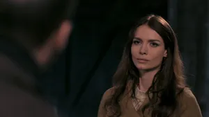 Saffron Burrows Striking A Pose In A Stylish Outfit Wallpaper